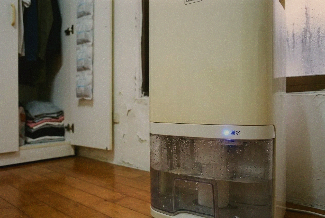 Dehumidifier running in a Taipei apartment with humidity reading display