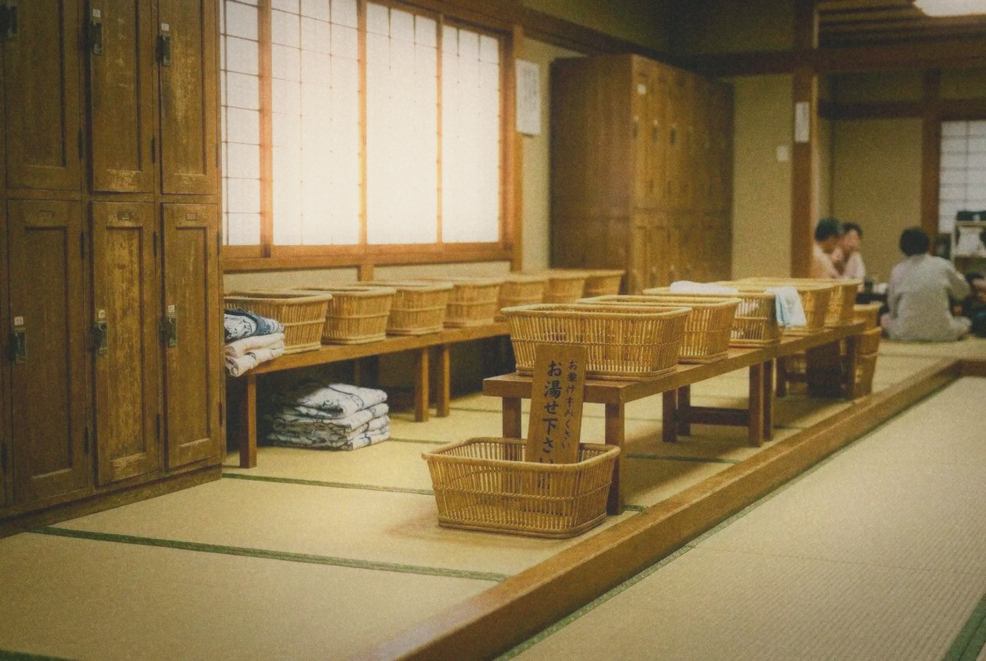 Traditional Japanese onsen changing room with wooden lockers