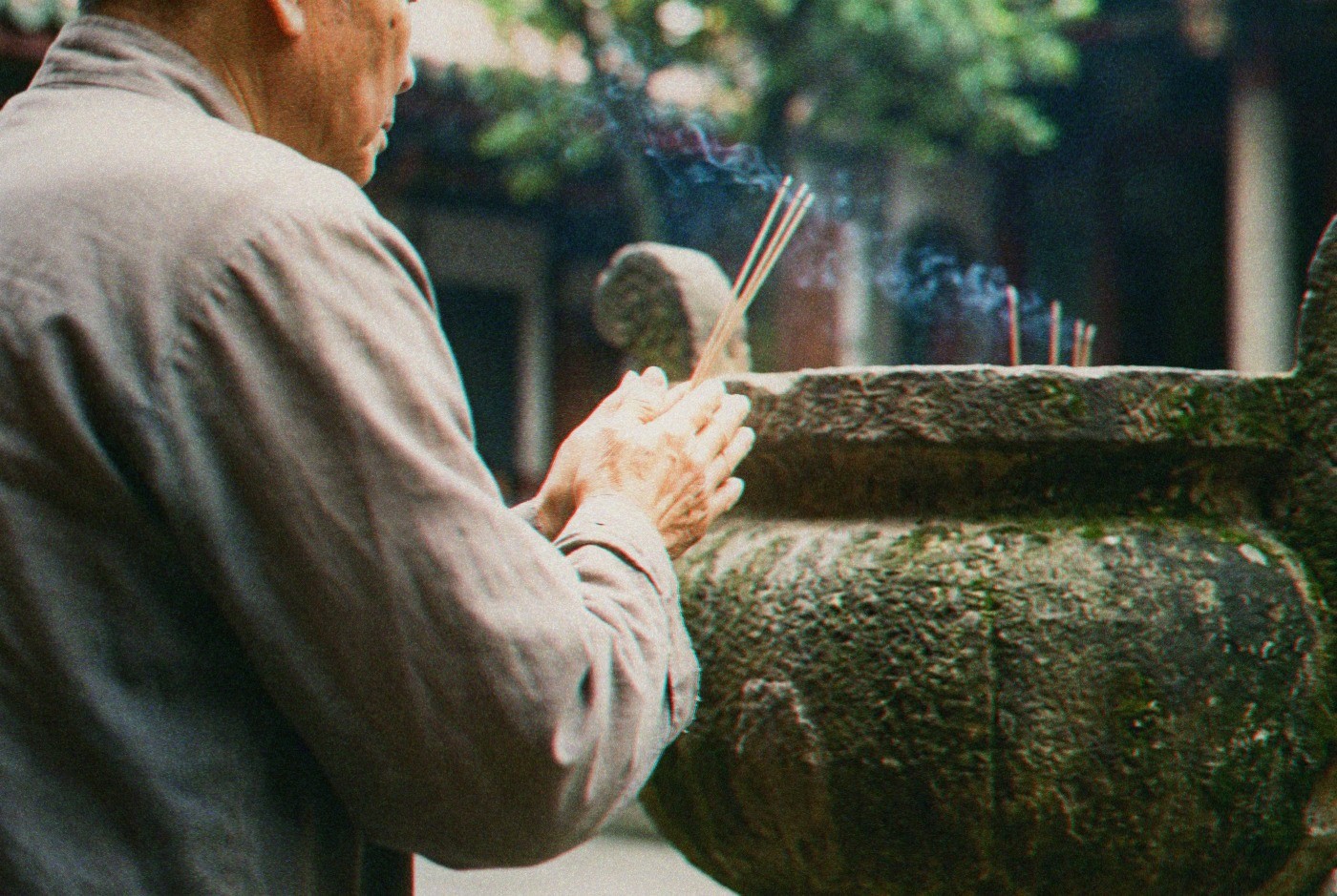 Illustration: Incense held beside a weathered stone burner