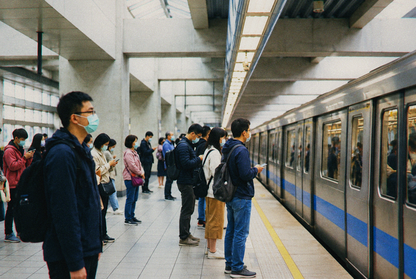 Taipei MRT station platform with commuters waiting