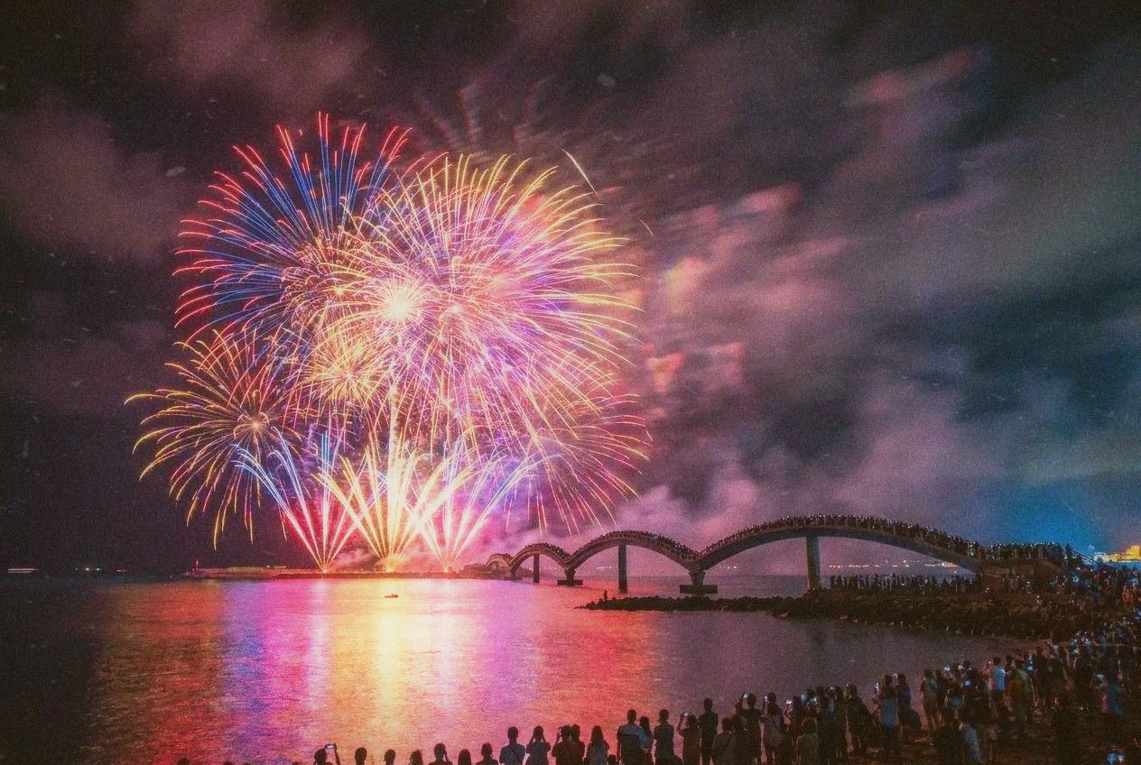Penghu fireworks festival at night with colorful fireworks over the ocean