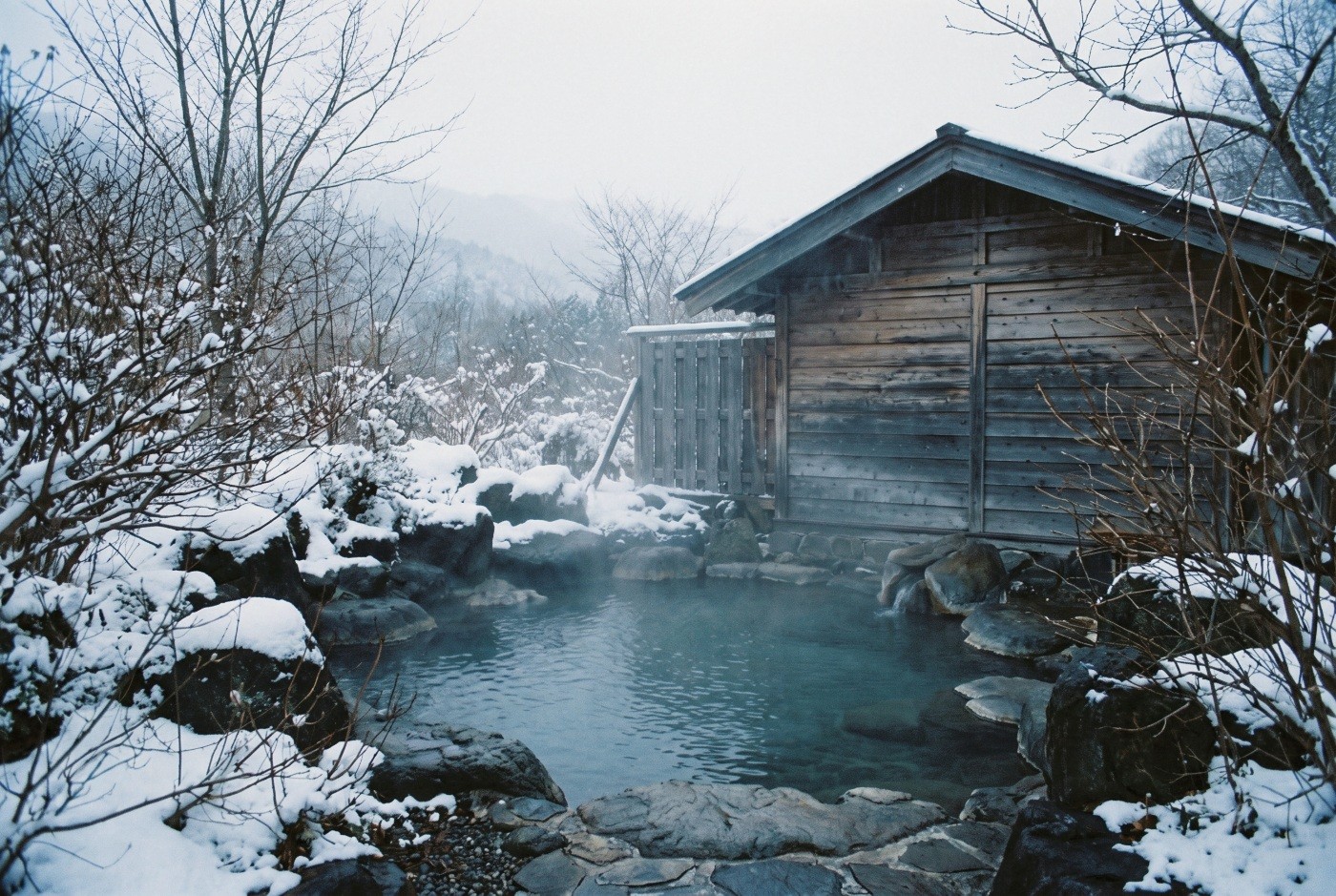 Illustration: A steaming outdoor bath in the snow.