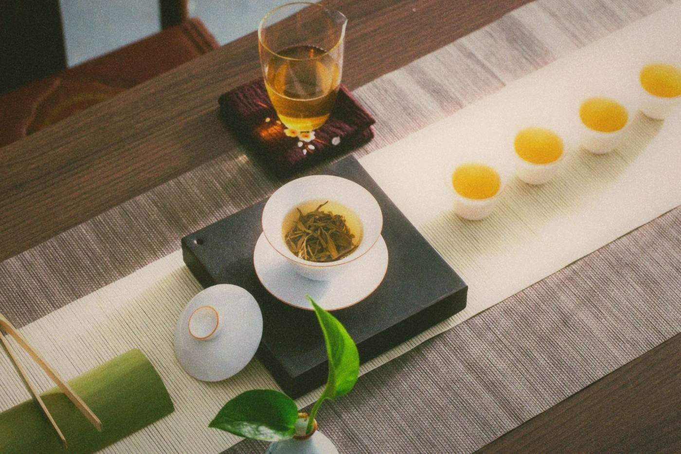 A traditional gongfu tea set arranged on a simple wooden surface