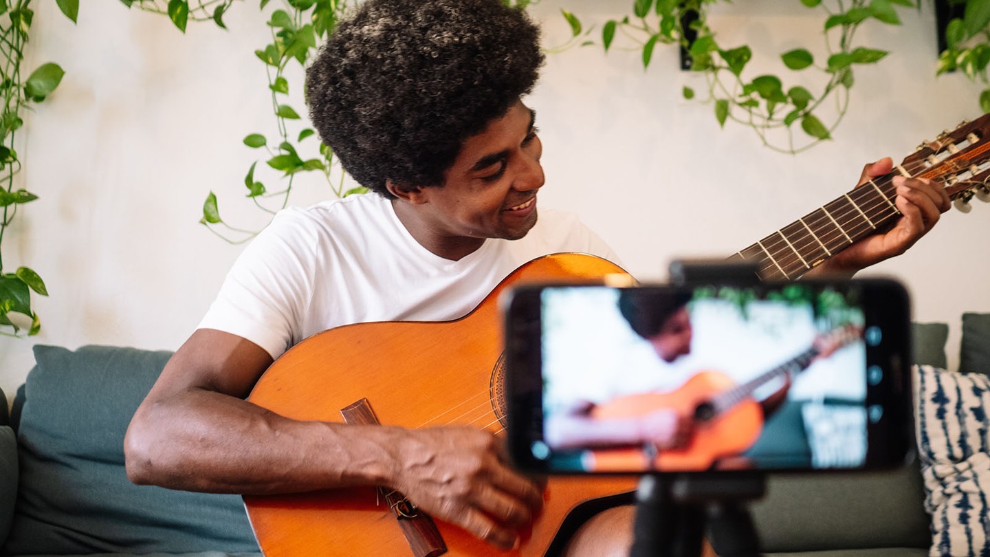 Illustration of a content creator filming with camera, microphone, and laptop in a studio