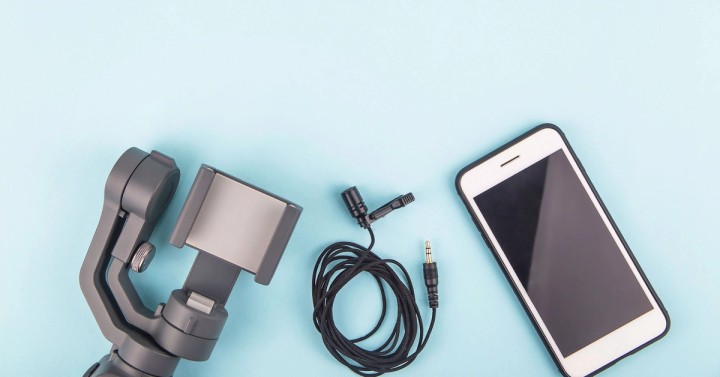 Illustration of a webinar setup with camera, microphone, ring light, and laptop