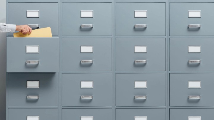 Illustration of an email list being segmented into groups with tags and envelopes