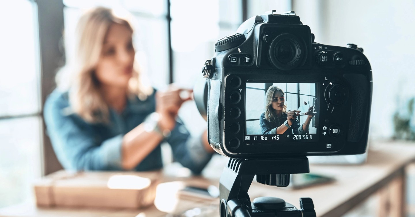 Illustration of a video marketing strategy with play buttons, screens, and analytics charts