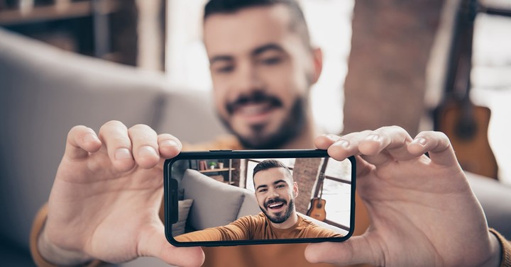 Illustration of an iPhone recording professional video with tripod and lighting setup