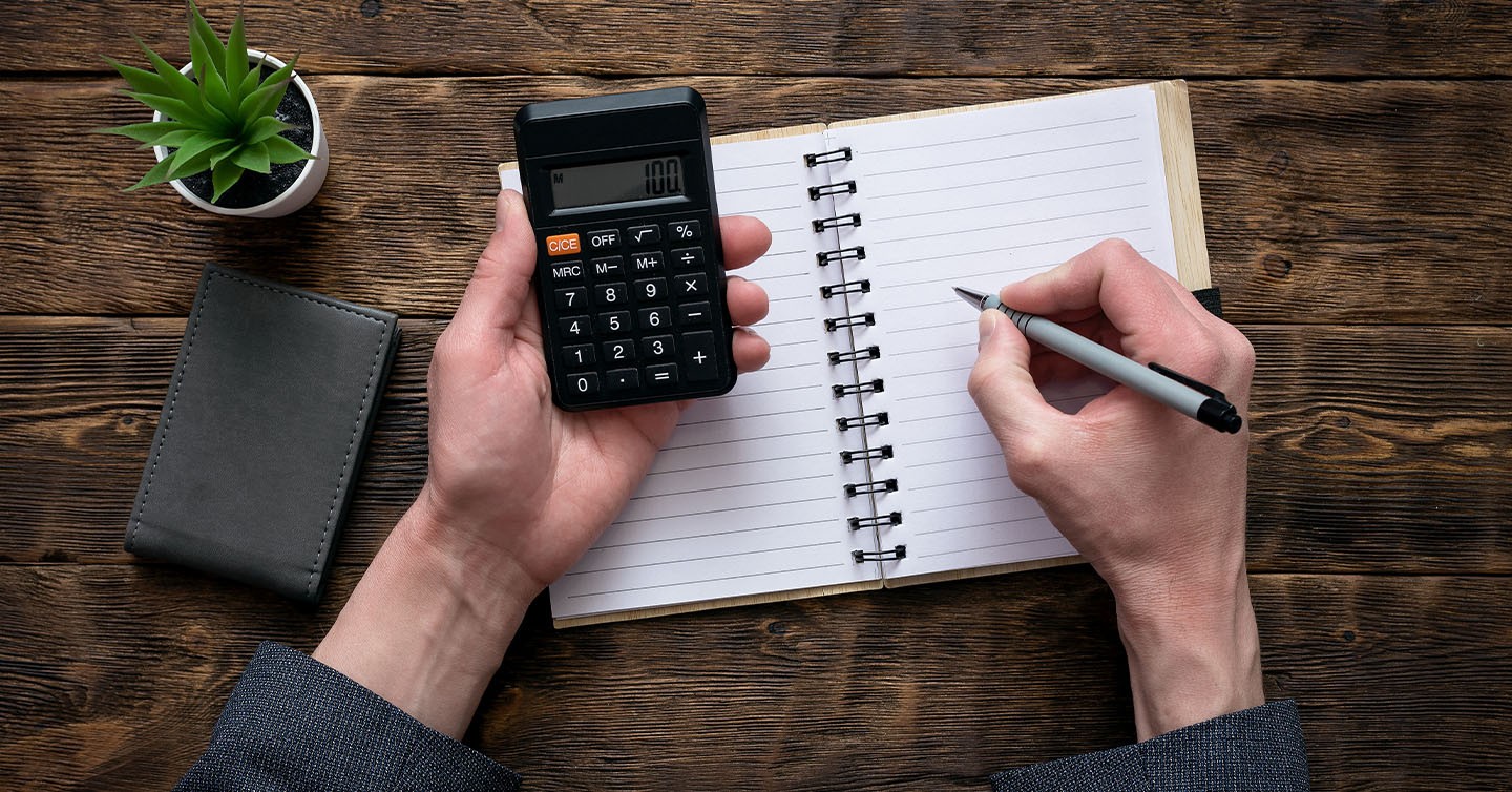 Illustration of online course costs with calculator, dollar signs, and production tools