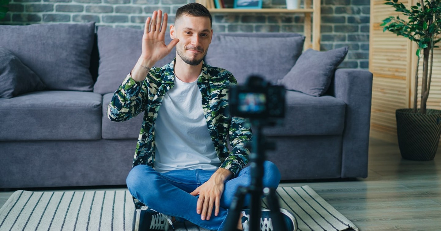 Illustration of a creator recording online course videos at home with camera lights and microphone