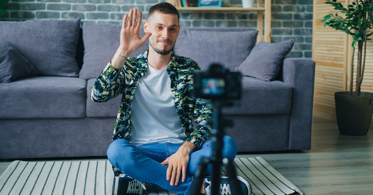 Illustration of a creator recording online course videos at home with camera lights and microphone