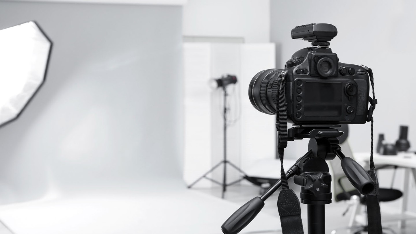 Illustration of a photographer with camera surrounded by income stream icons and dollar signs
