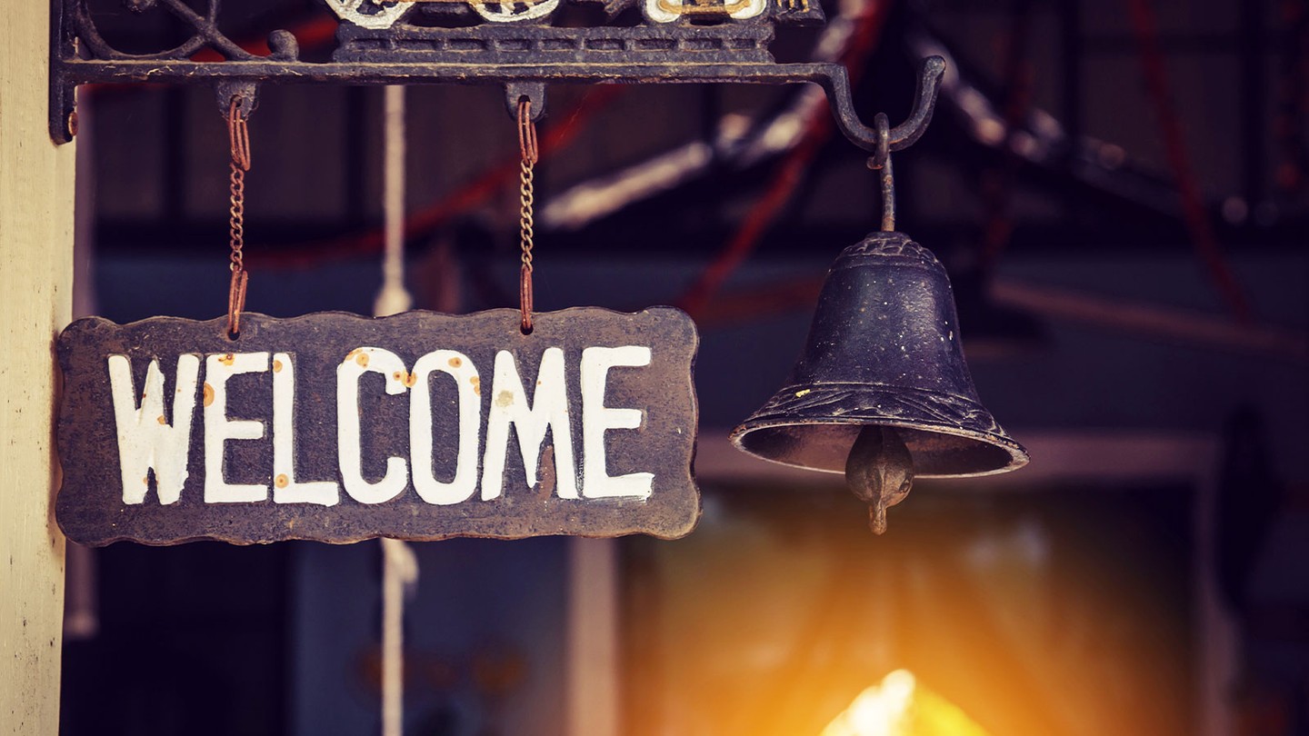 Illustration of a welcome email envelope opening with a friendly greeting to new subscribers