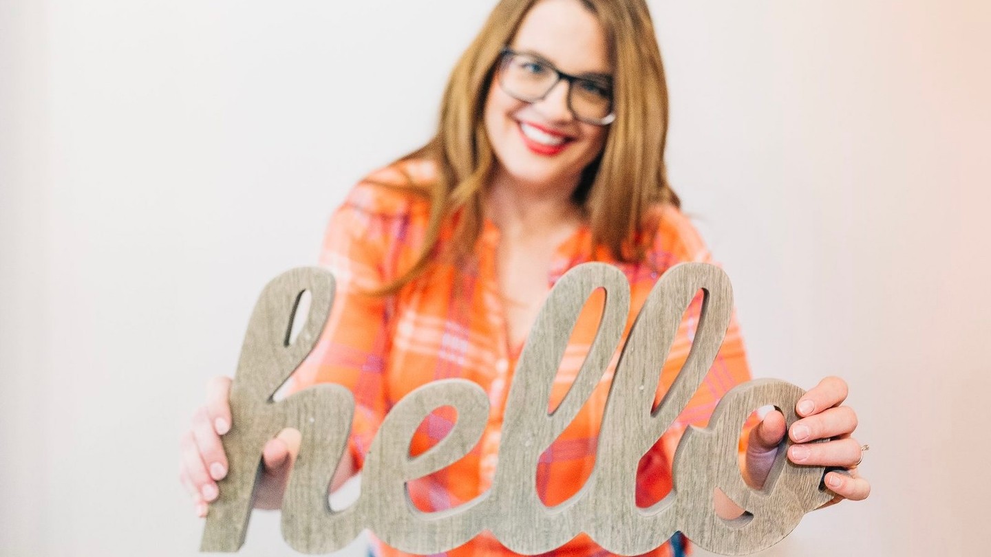 Portrait of mindset coach Becky Mollenkamp with coaching session and heart icons