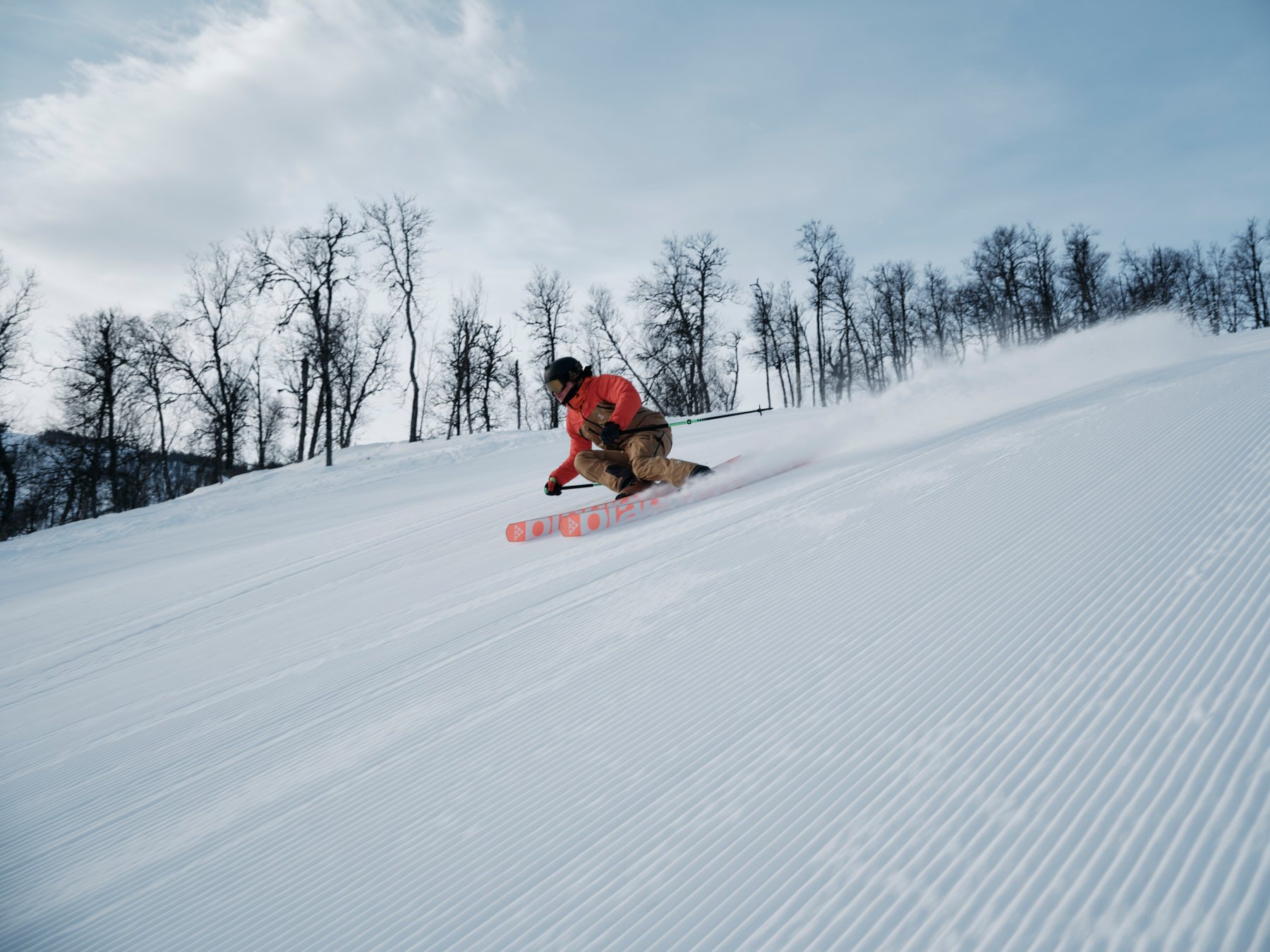 A man skiing down a ski slope.