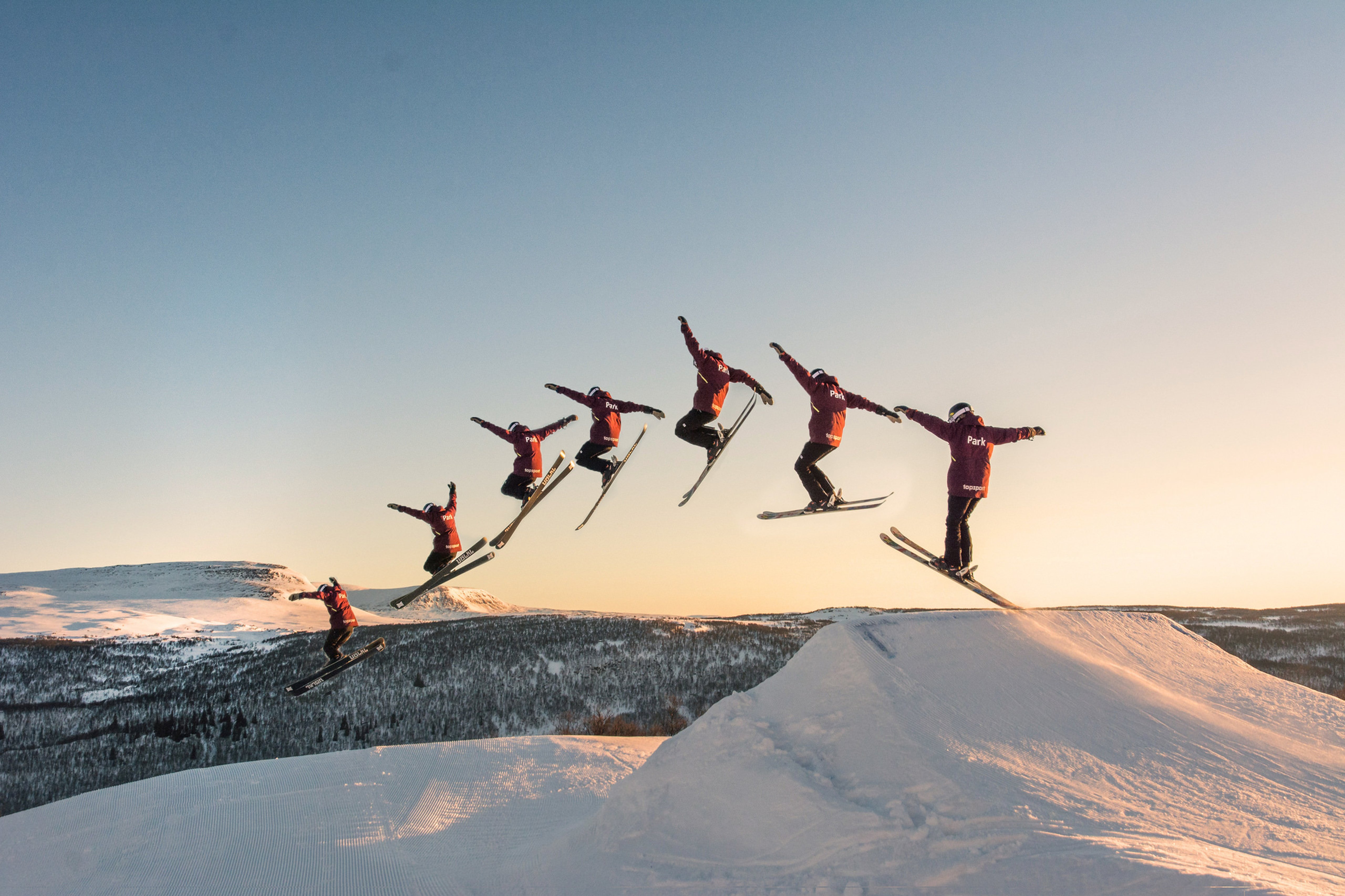 A man flying through the air on skis.