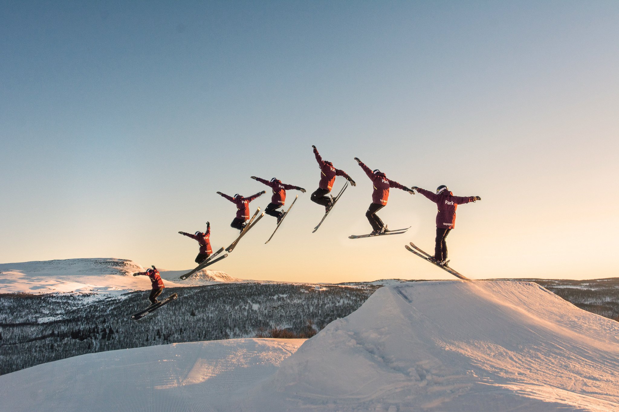 A man flying through the air on skis.