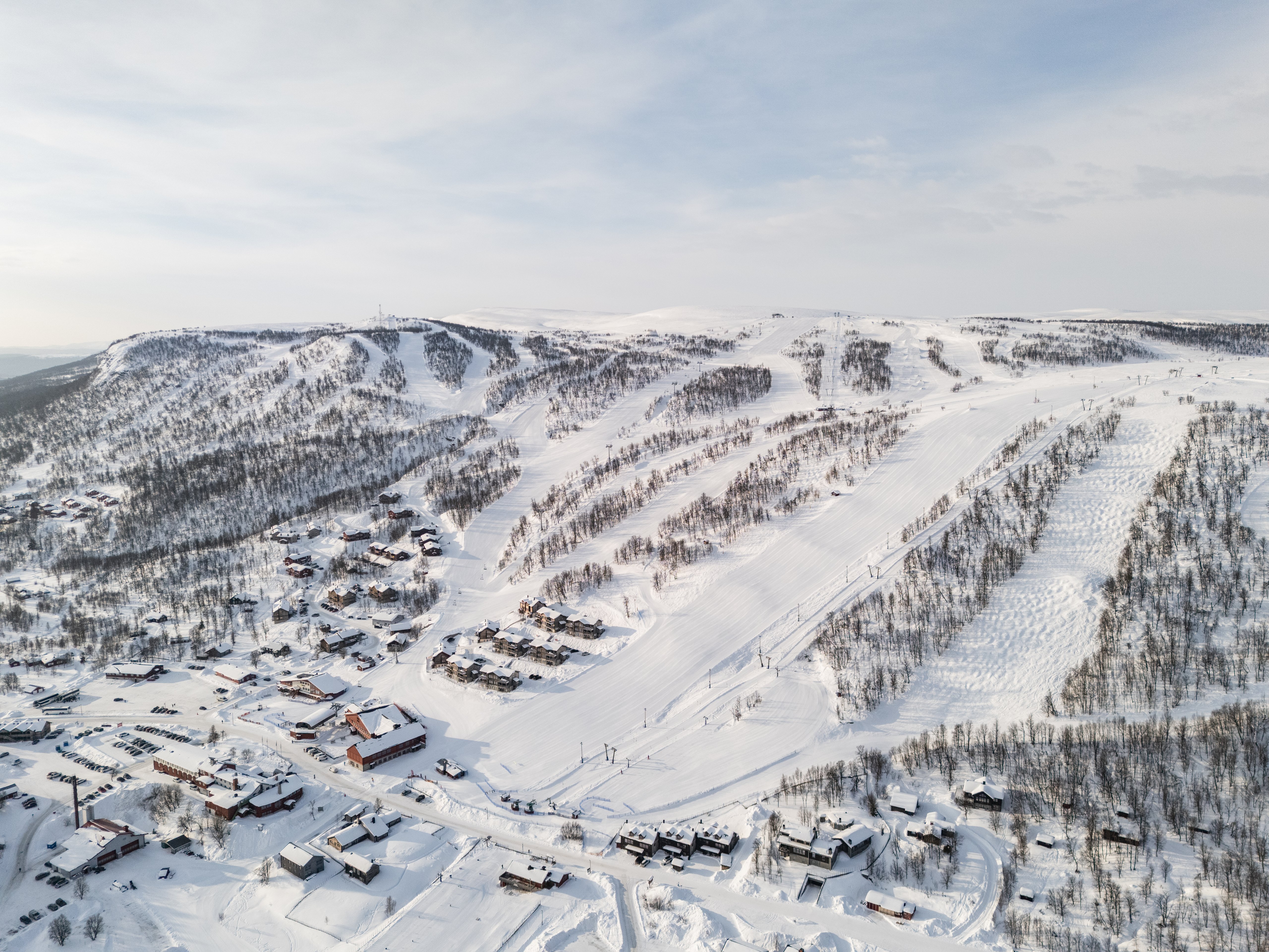 An aerial view of a ski resort in the mountains.