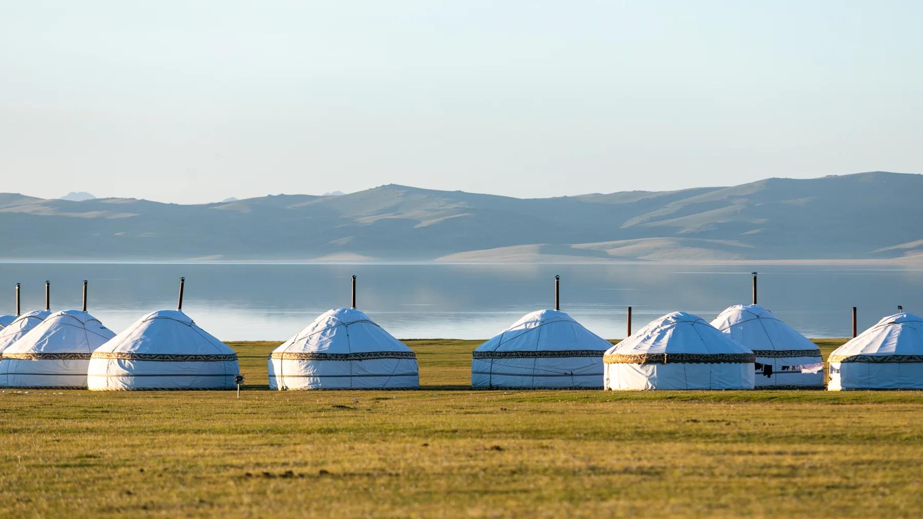 Nomad yurts on the shore of a lake in Central Asia