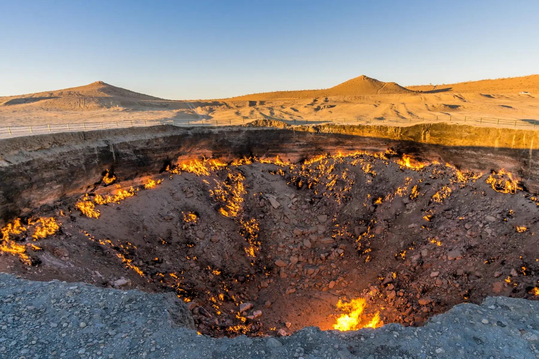 A desert road crossing the Karakum landscape