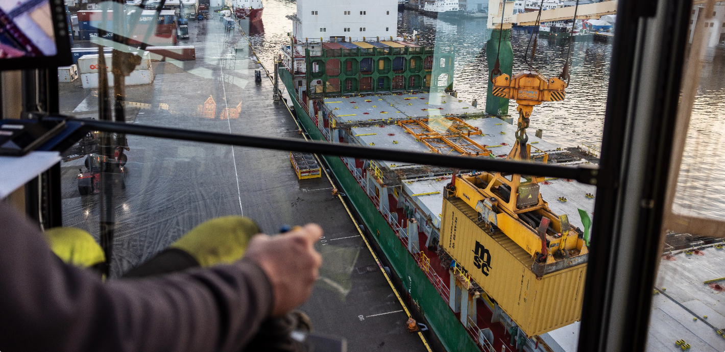 Harbor crane lifting a container