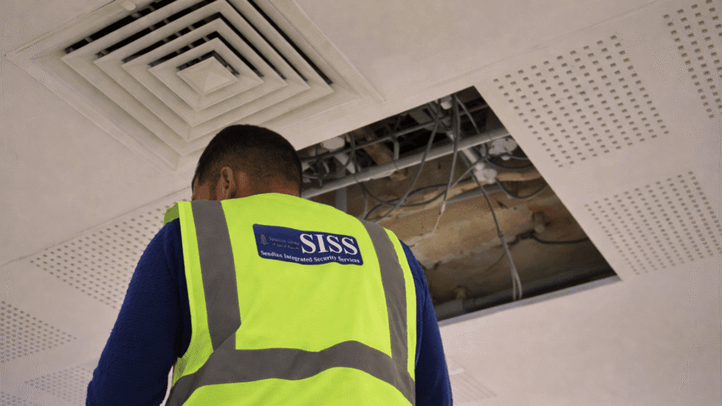 SISS technician installing CCTV infrastructure at Qatar Finland International School