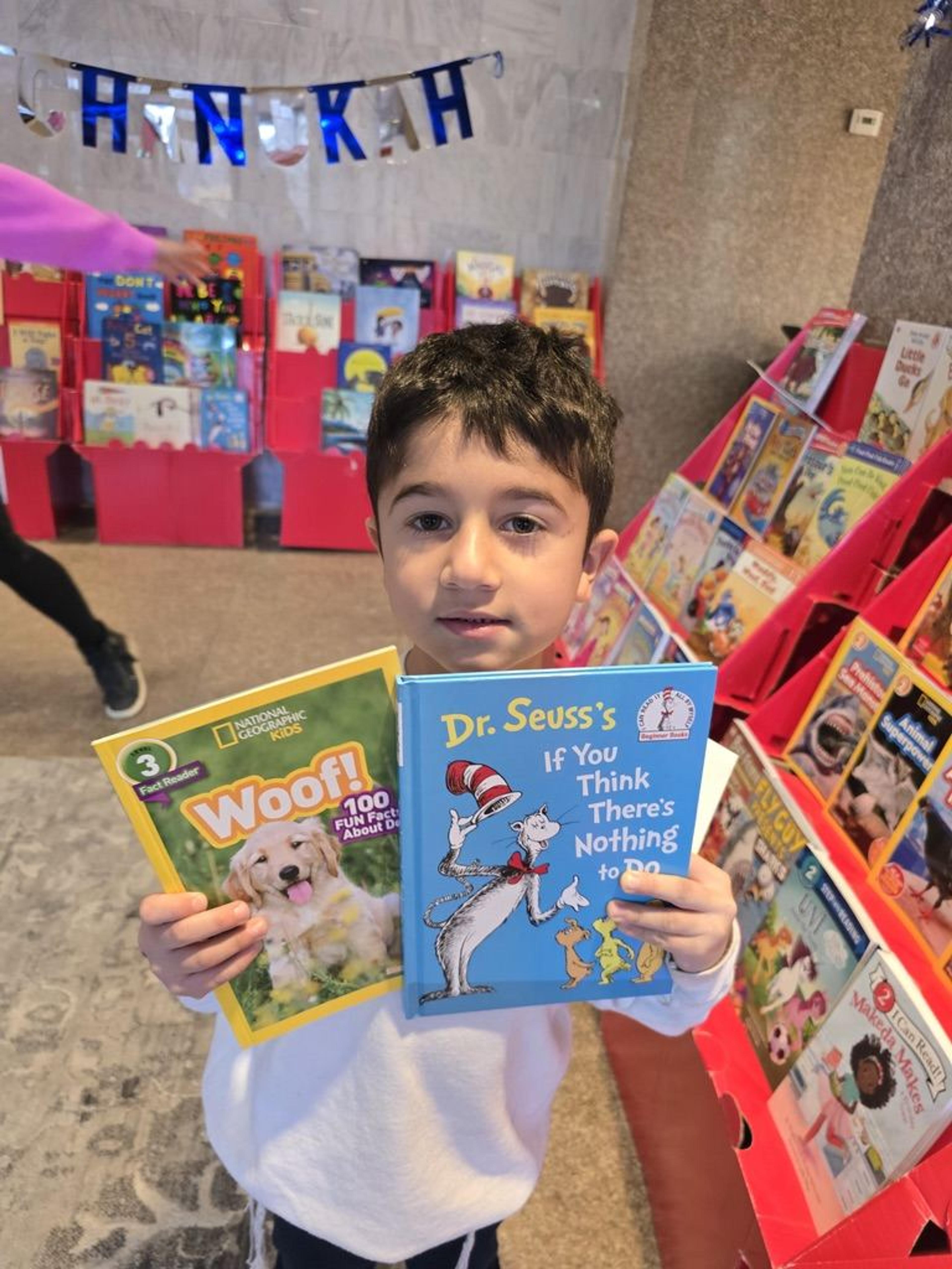 A student with books at the book fair