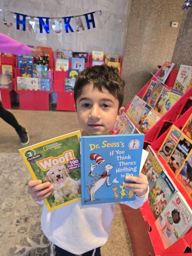 A student with books at the book fair