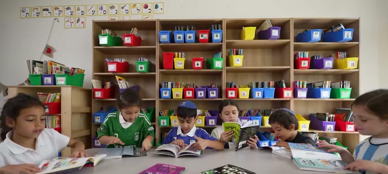 Students reading together in the MESA library