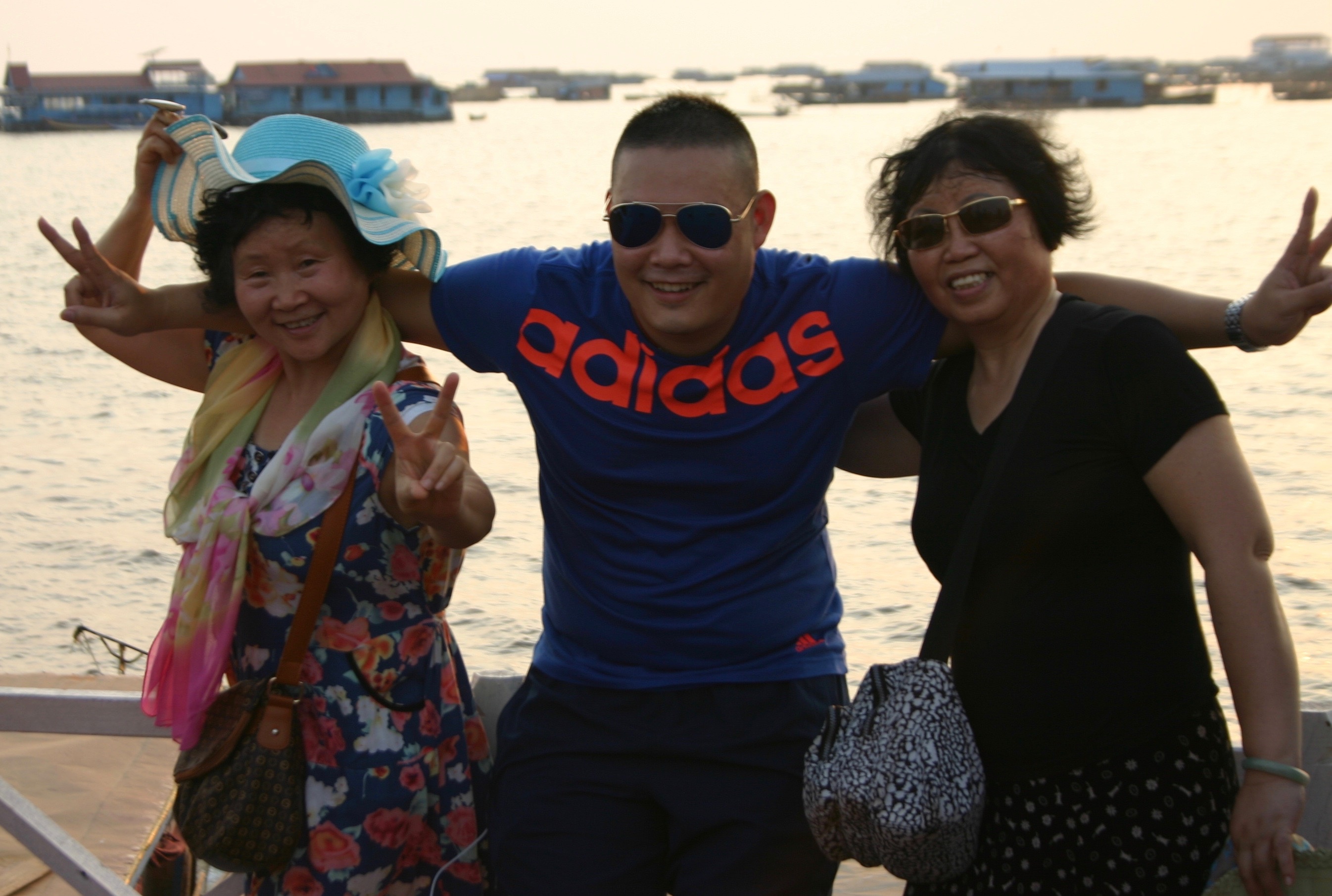 Chinese tourists pose for a photo in Cambodia. (Jing Daily)