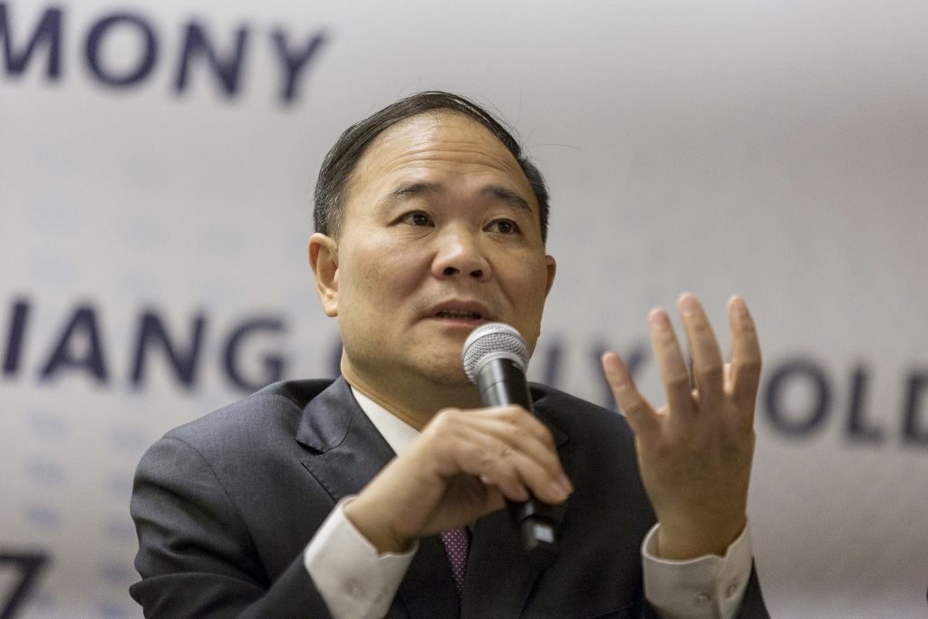 Billionaire Li Shufu, founder and chairman of Zhejiang Geely Holding Group Co., speaks during a news conference in Kuala Lumpur, Malaysia, on Friday, June 23, 2017. Image via VCG.