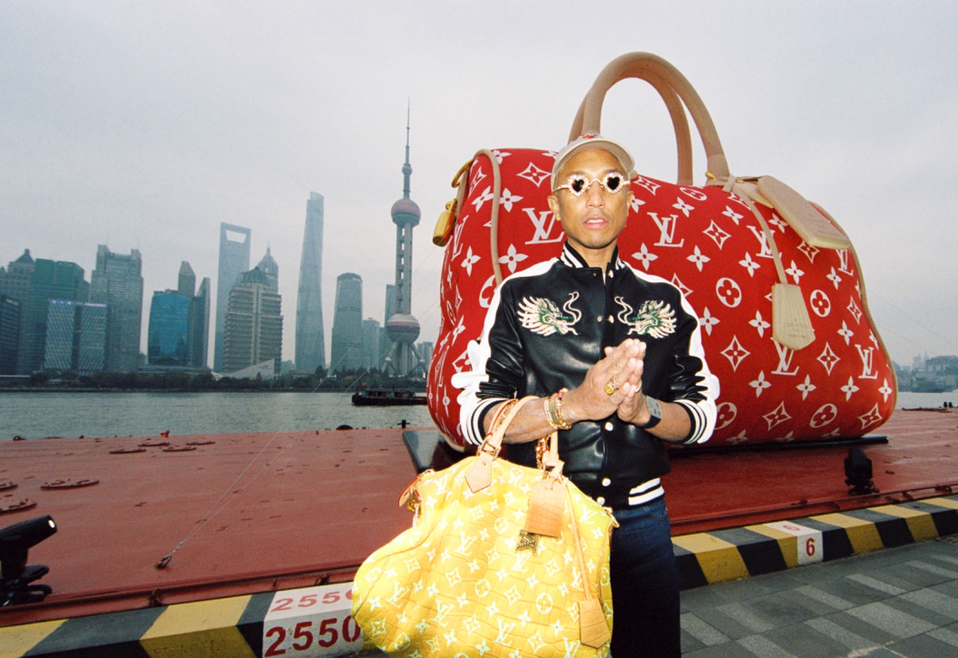 Pharrell Williams stopped by Louis Vuitton's iconic Speedy handbag installation along Shanghai's Huangpu River. Photo: Louis Vuitton