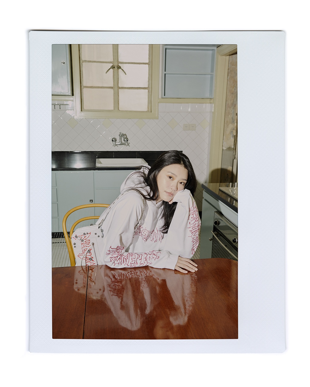 The Balenciaga New Year campaign is set against the backdrop of comfortable home settings. Photo: Balenciaga