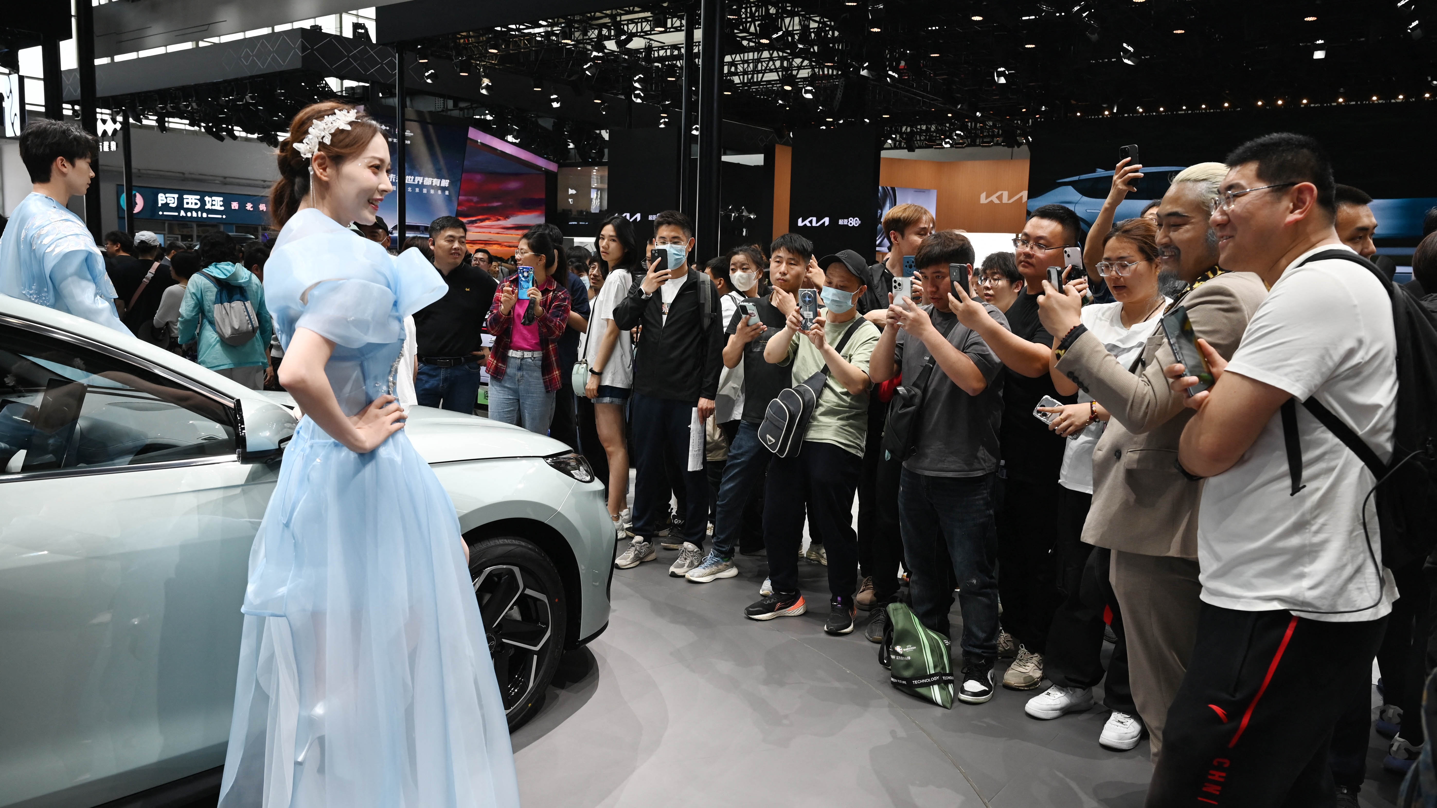 Crowds gather to photograph cars on the BYD stand at the Beijing Auto Show in Beijing on May 3, 2024. Photo: Getty Images