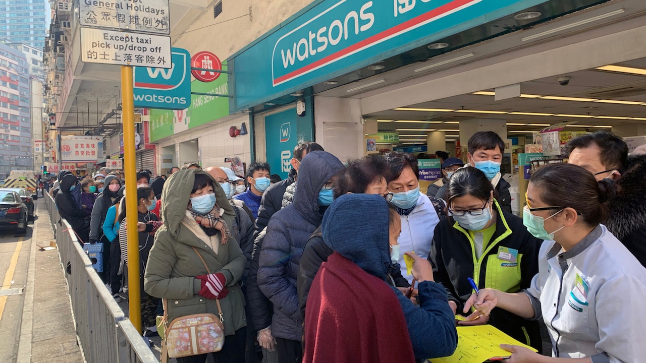 In Hong Kong, long lines await citizen’s trying to purchase medical masks from a dwindling supply. Photo: Lewis Tse Pui Lung/Shutterstock