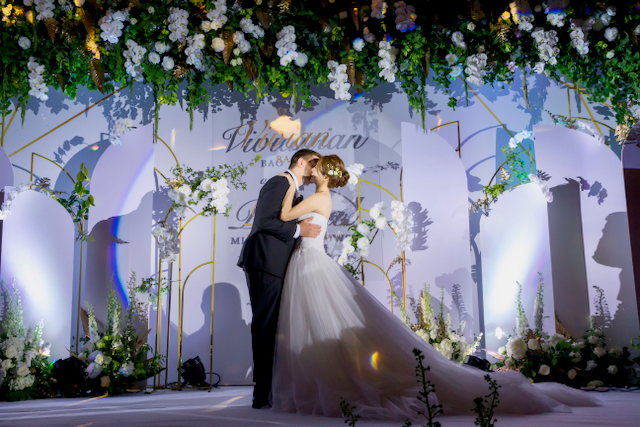 Bride Vivian Bao and her partner at their wedding in China last year. Photo: Courtesy of Vivian Bao