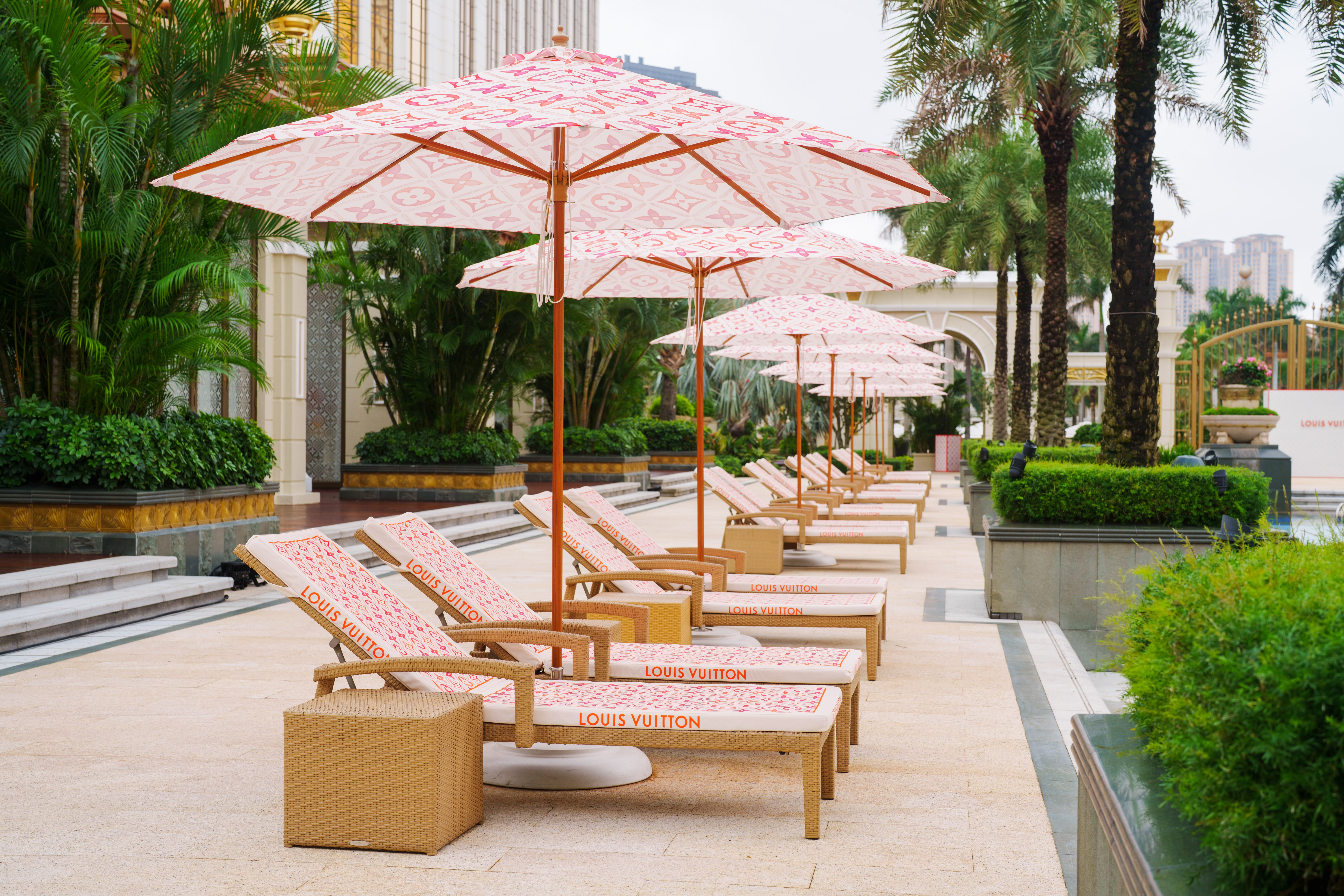 The LV monogram decorates beach chairs and poolside umbrellas. Image: Galaxy Macau