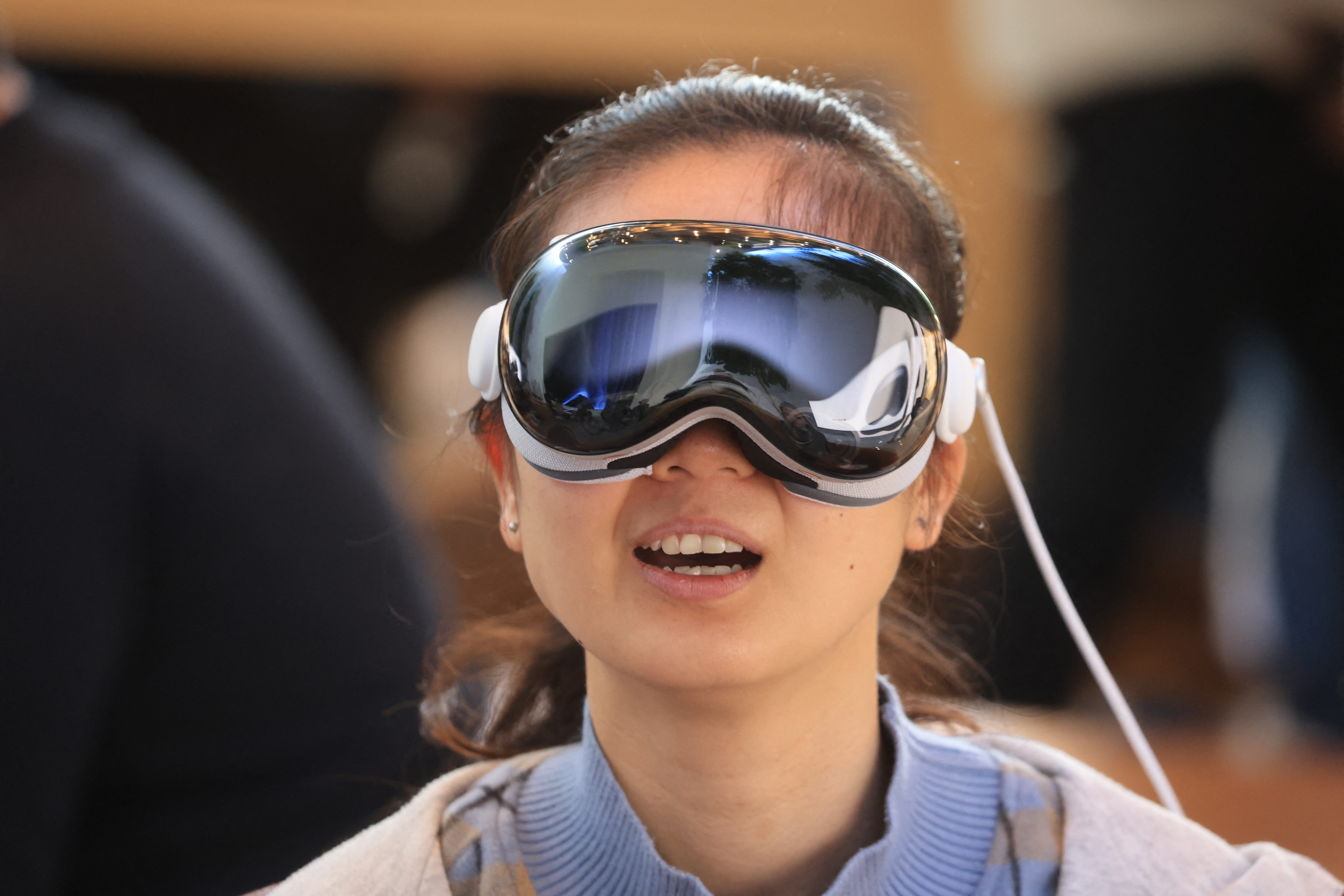 A customer tries on Apple's Vision Pro at The Grove in Los Angeles, California, on February 2, 2024. Tabao's app can be used on Apple’s mixed-reality headset. Image: Getty Images