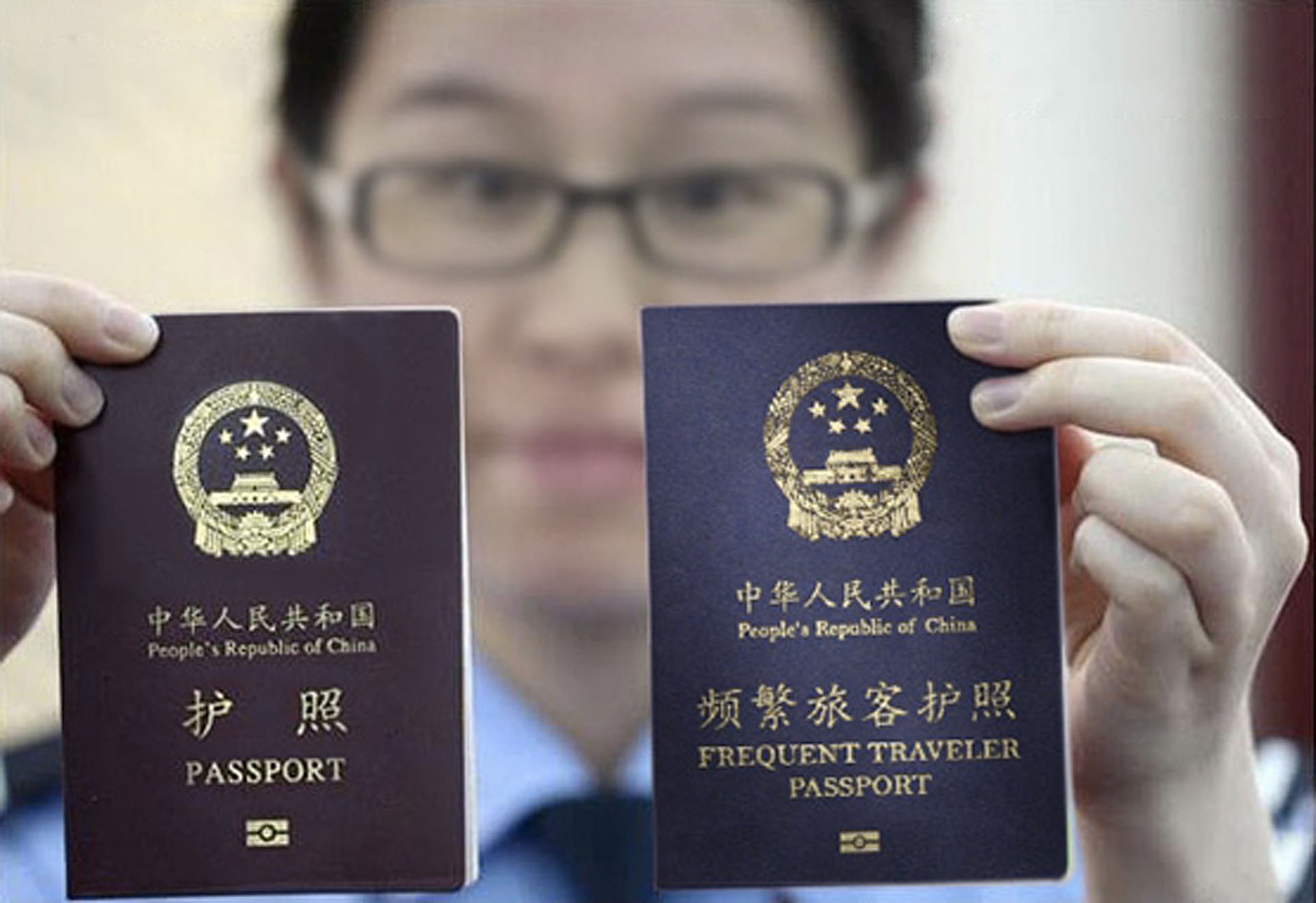 The edited image that accompanied the story shows a new "frequent traveler passport" next to the ordinary Chinese passport.