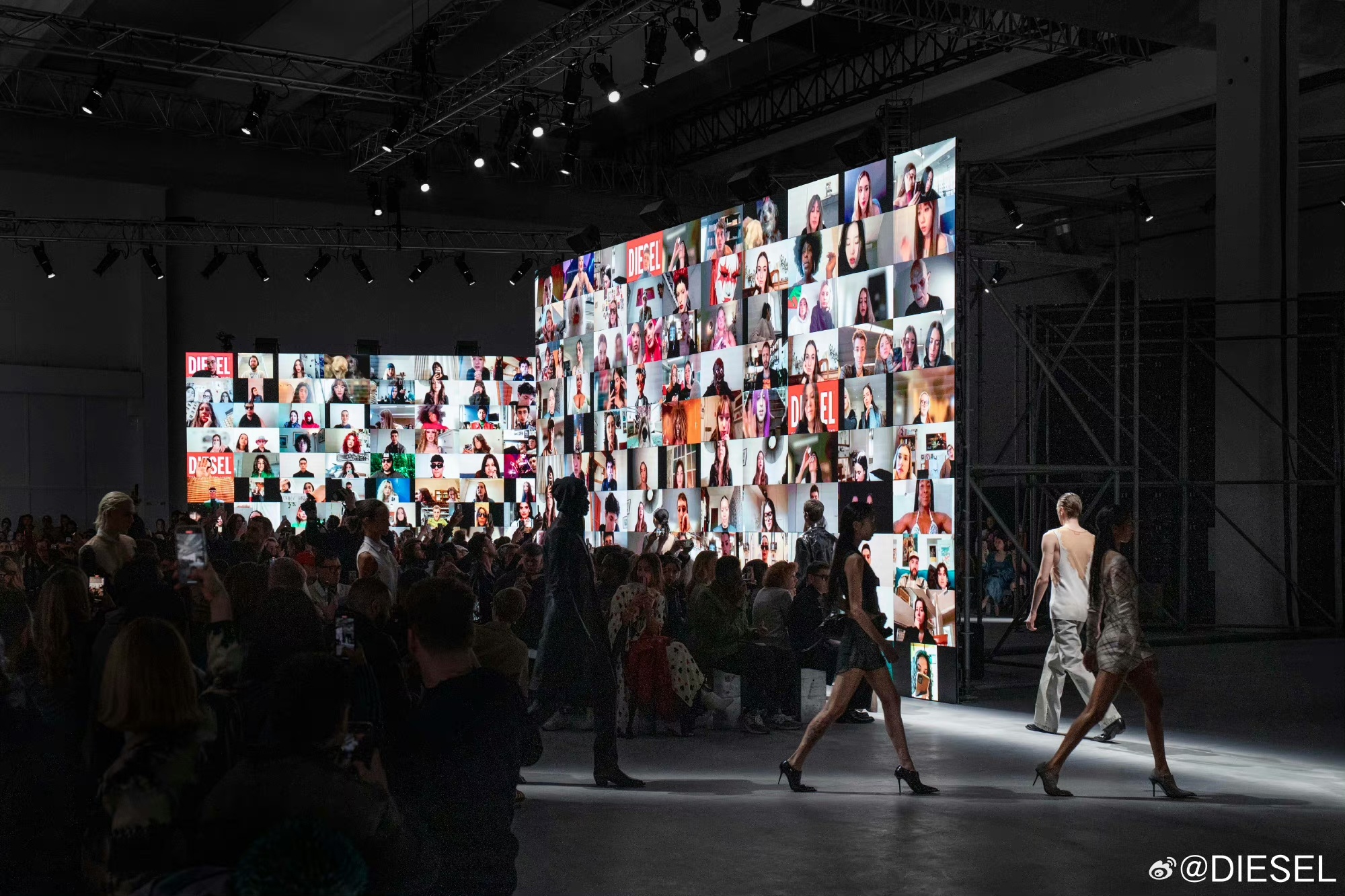 At Diesel's Fall Winter 24/25 show, a noteworthy element was introduced as attendees sat before colossal screens broadcasting a Zoom call featuring over 1,000 meeting participants. Photo: Diesel