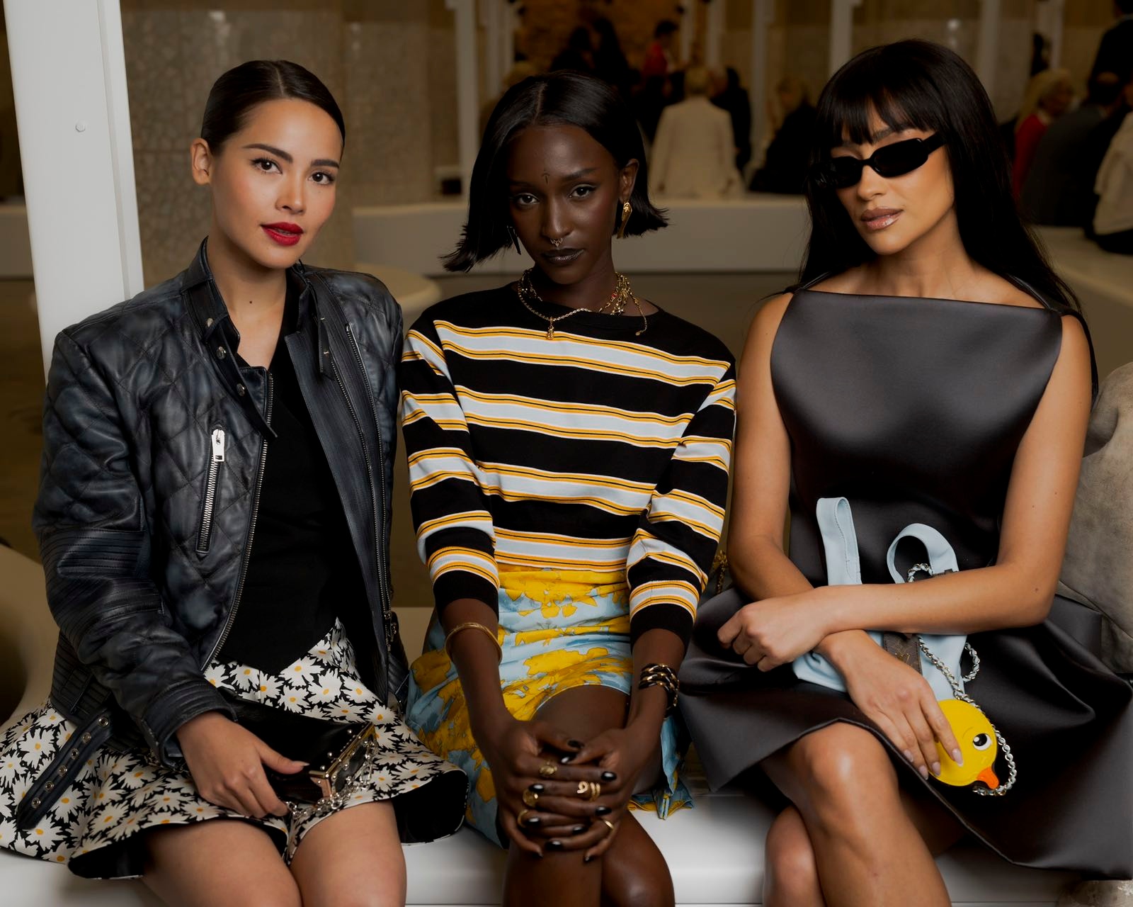 International celebrities (left to right) Yaya, Lous and the Yakuza, and Shay Mitchell sit front row in Barcelona’s Park Güell. Image: Louis Vuitton.