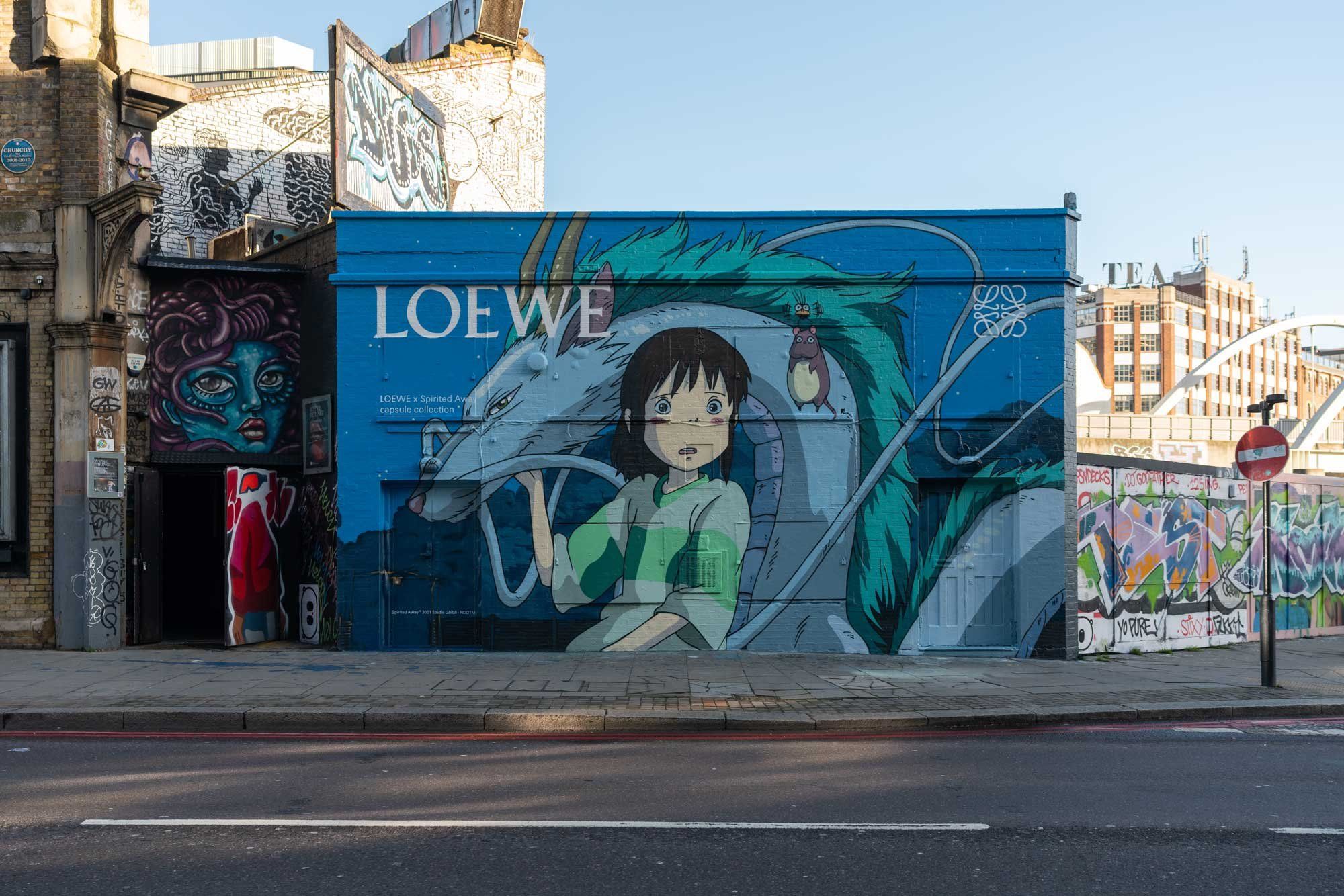 From Loewe to Swarovski, hand-painted murals get a luxury upgrade