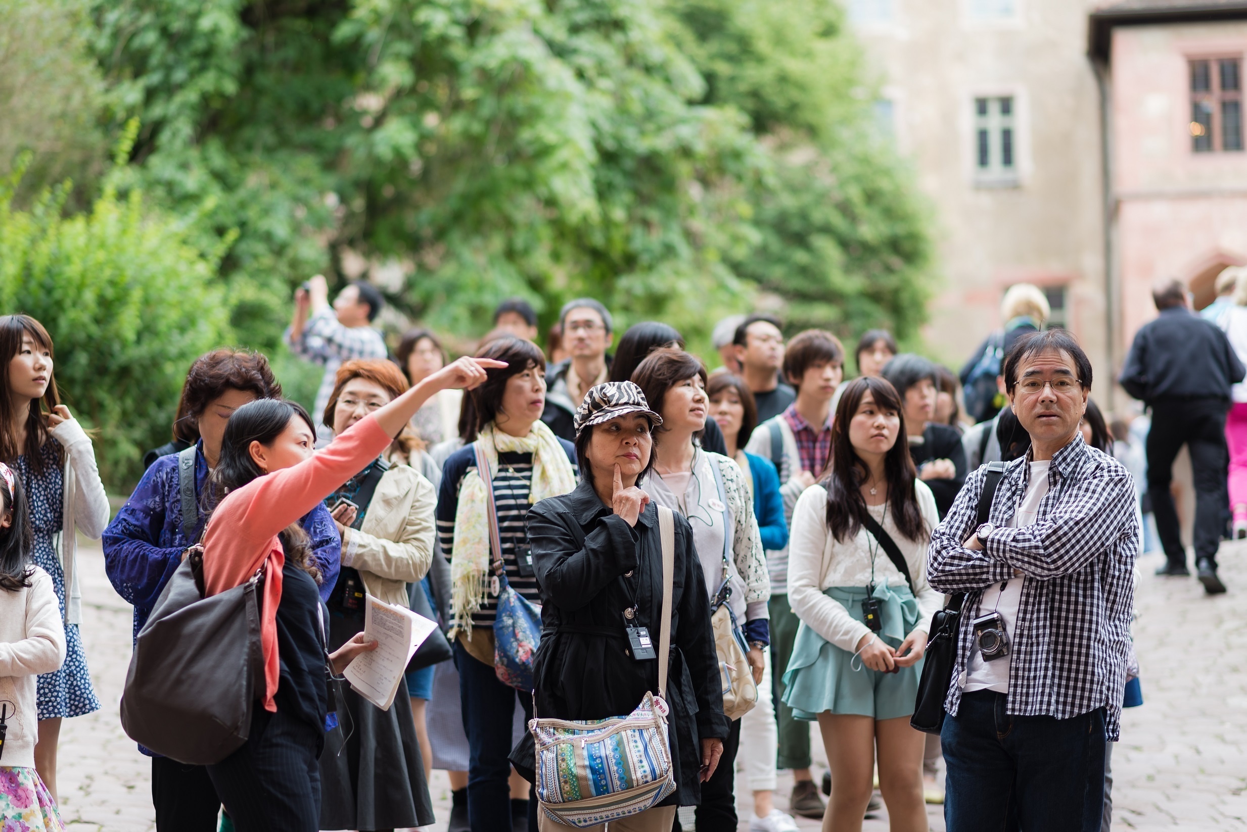 Chinese travelers tour a castle in Germany. In a new Hotels.com survey about one-third of respondents said they would spend more on outbound travel in the next year. <a href="http://shutterstock.com">(Shutterstock)</a>