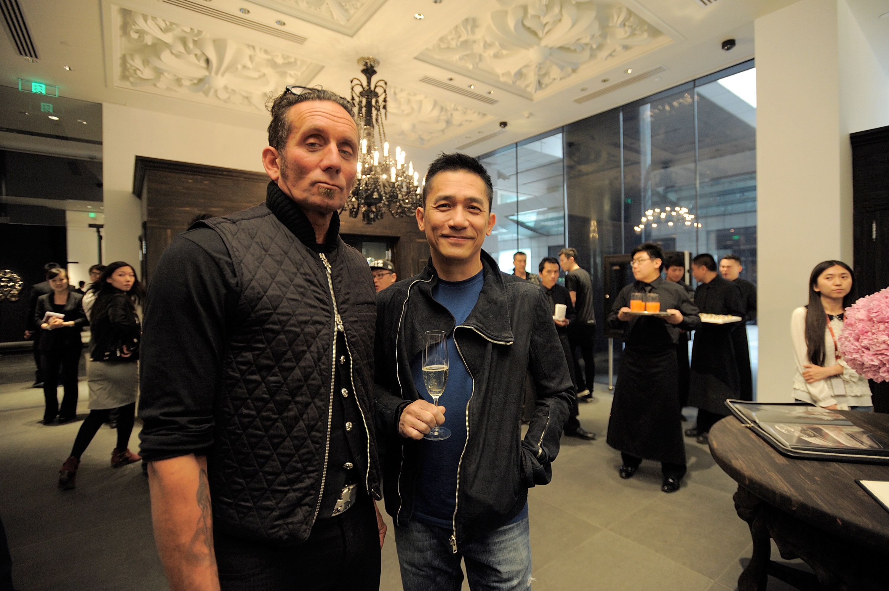 Chrome Hearts founder Richard Stark, left, and Hong Kong actor Tony Leung pose for a picture during the Chrome Hearts Beijing store opening on May 14, 2014 in Beijing. Photo: Getty Images
