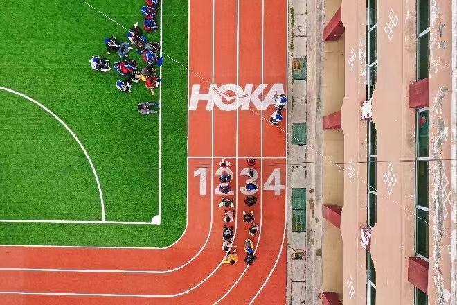 Hoka collaborated with the Shanghai United Foundation to donate running tracks to two schools in Litang. Photo: Hoka