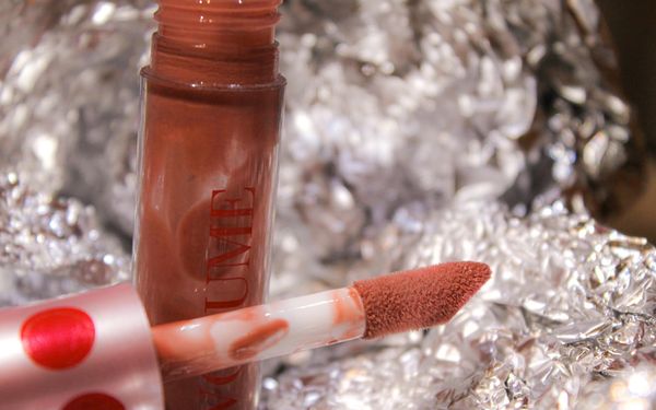 a close up of a lipstick on a piece of tin foil