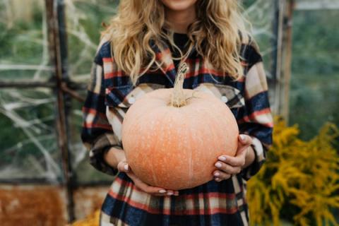 woman holding pumpkin