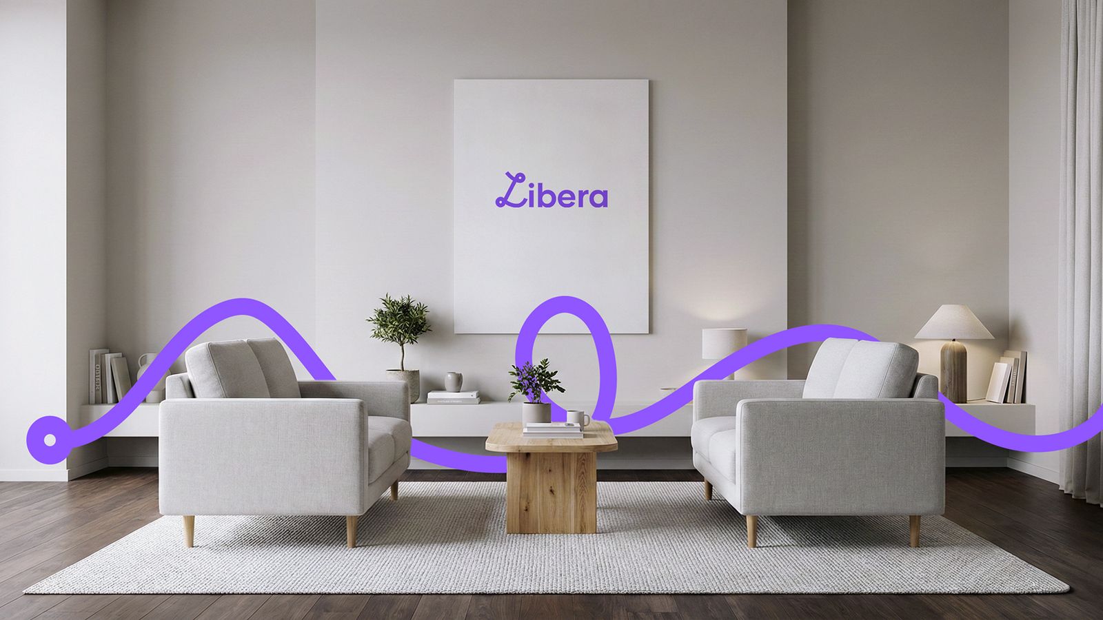 Sala de estar moderna con dos sillones grises, una mesa de madera y un cuadro con la palabra Libera, atravesada por un trazo ondulado de color violeta que recorre la escena