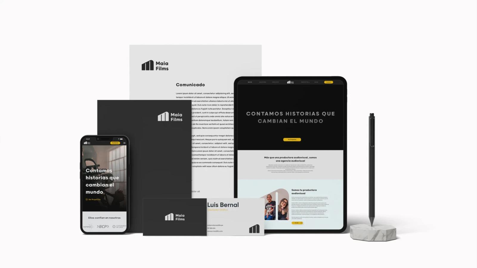 Set de identidad corporativa de Maia Films con papelería y dispositivos digitales mostrando sitio web con el eslogan Contamos historias que cambian el mundo sobre fondo blanco