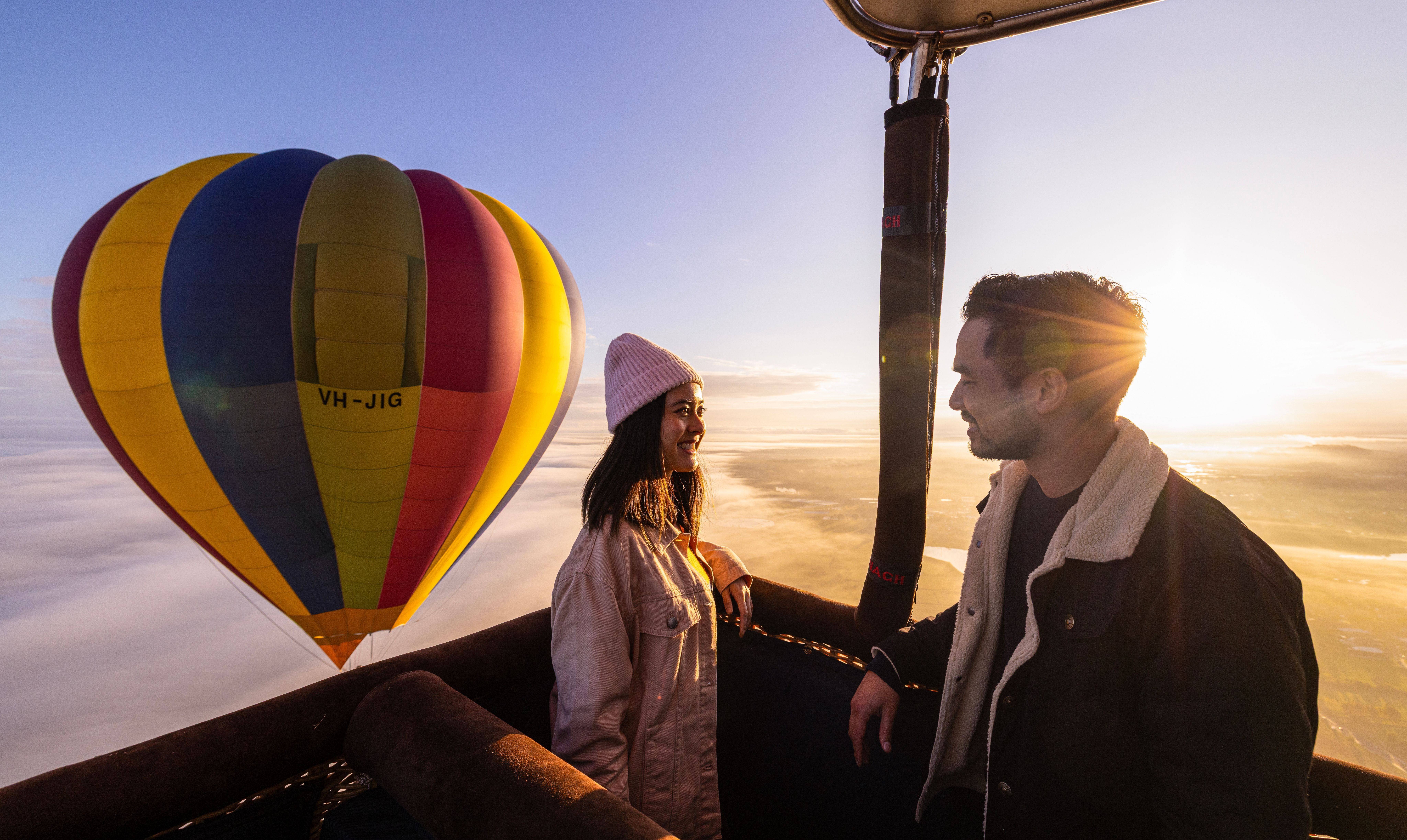 Couple enjoys views over Camden during a hot air balloon flight.